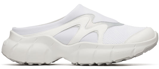 A white slip-on sneaker with a chunky sole.