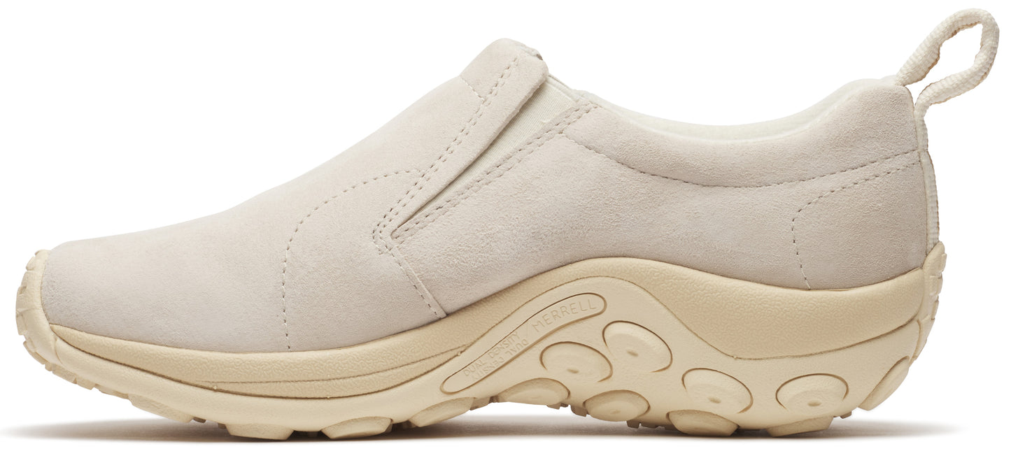 Beige slip-on shoe with a thick sole and a pull tab at the heel.
