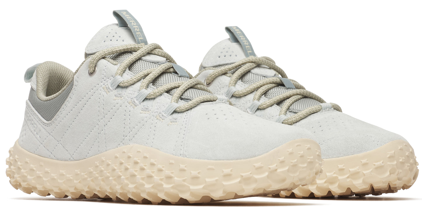 Two athletic shoes are shown at a slight angle. The shoes have a tan patterned sole, light gray upper with laces, and a light gray heel.