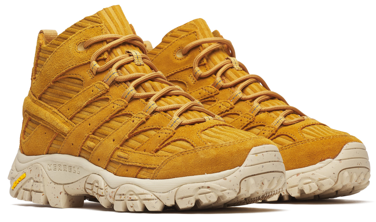 Pair of golden tan hiking boots with cream colored soles and laces.