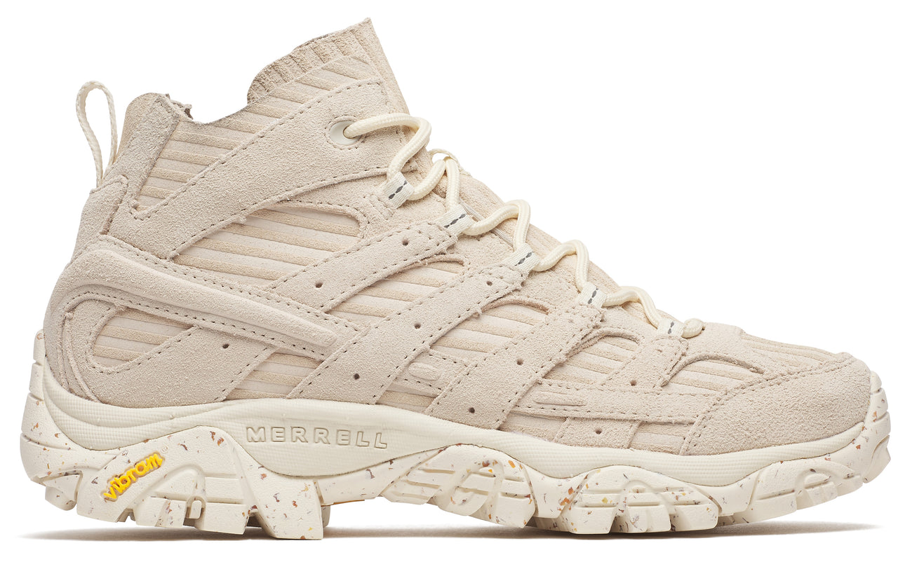 Tan hiking boot with laces and a textured sole.