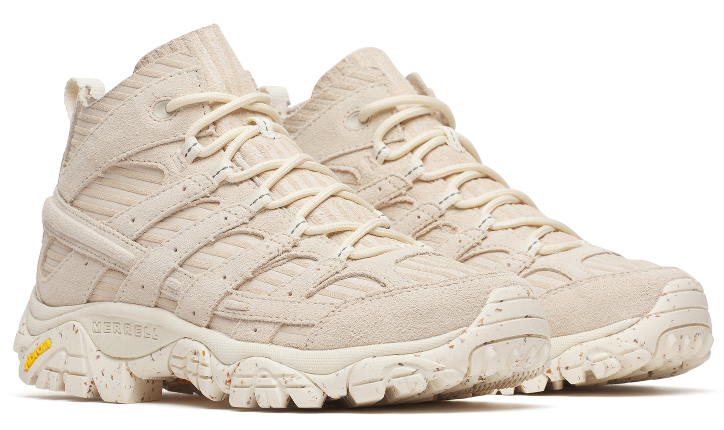 Pair of high-top hiking shoes in off-white with yellow detail.