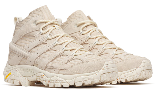 Pair of high-top hiking shoes in off-white with yellow detail.