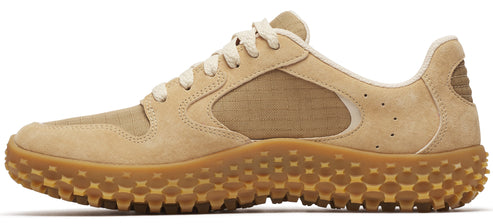 A low-top beige sneaker with a nubbed sole.
