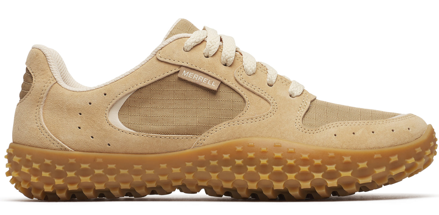 A tan sneaker with light beige laces and a tan, textured sole.