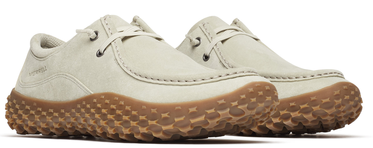 Two white nubuck-leather, boat-style shoes with brown lug soles.