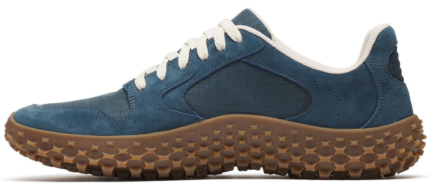 Blue shoe with brown sole and white laces.