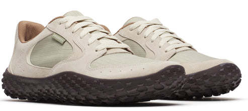 Two low-top sneakers in beige with brown textured soles and laces.