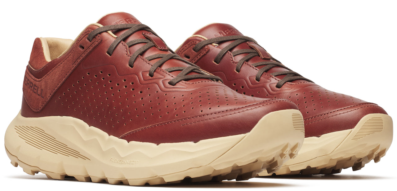 A pair of red leather sneakers with brown laces and tan soles.