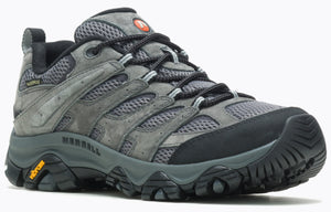 A grey hiking shoe with a thick black sole and black laces.
