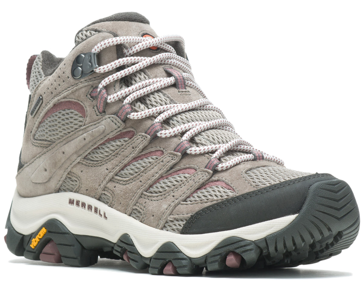 Hiking boot, gray suede and mesh upper, white midsole, lugged black and purple sole.