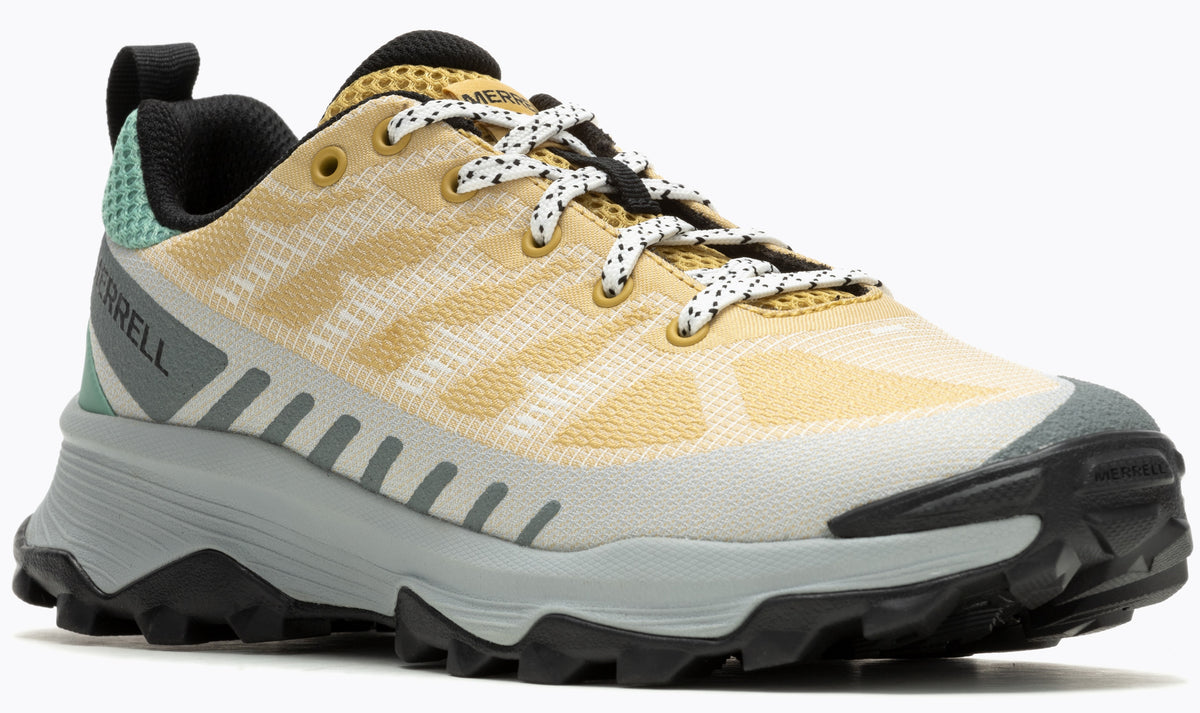 A low-top, off-white and tan athletic shoe with a black sole and laces.