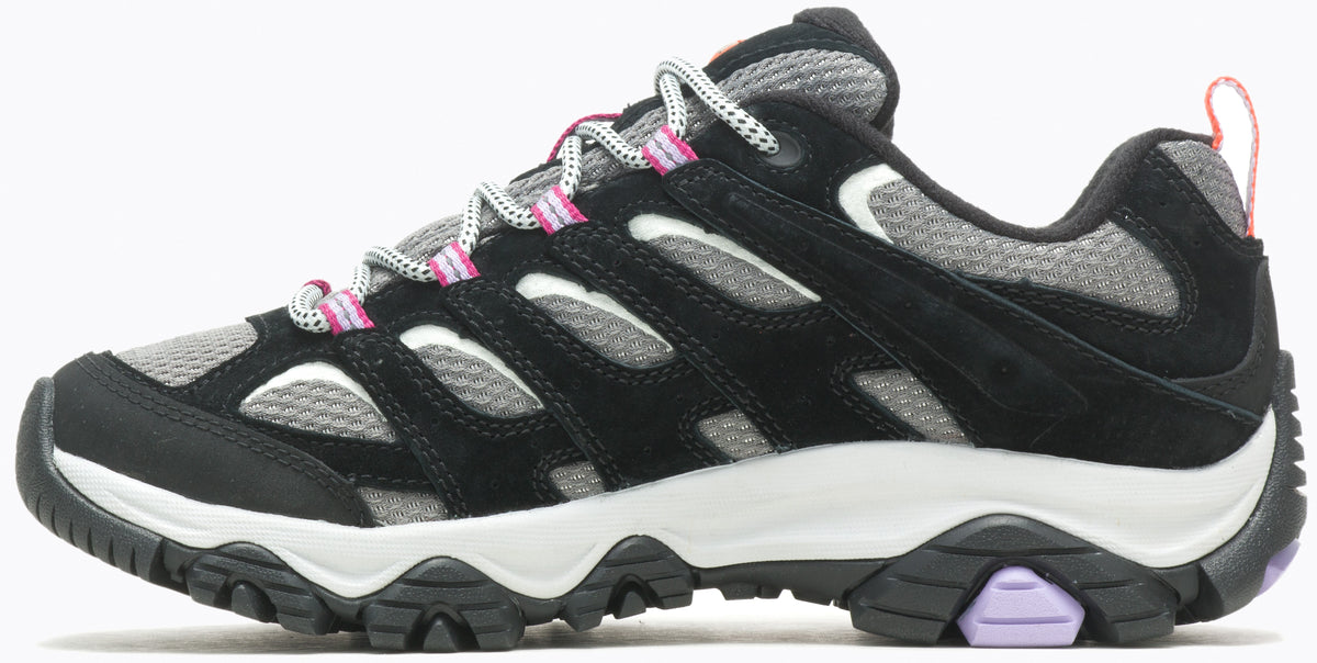 Low-cut trail shoe, black suede upper, light gray mesh, white and black laces with pink accents, white midsole, lugged black and lavender outsole.