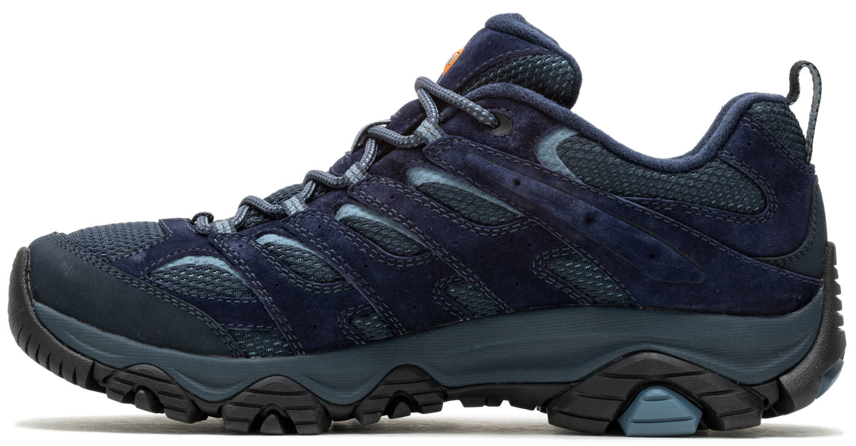 A navy blue hiking shoe with a thick, black lugged sole, visible laces, and a breathable mesh upper.
