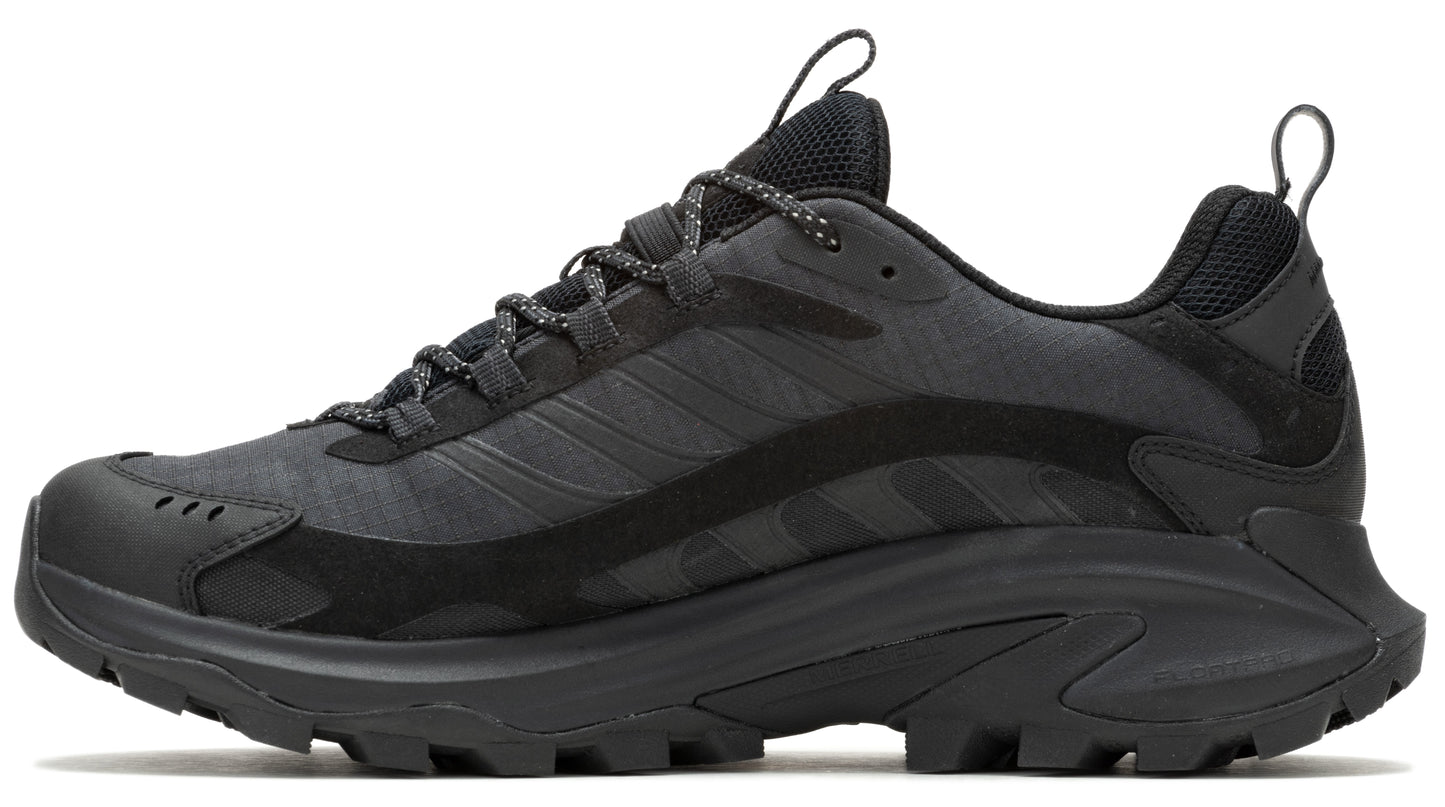 Side view of a trail running shoe in various tones of black, featuring a thick lugged sole and reinforced toe.