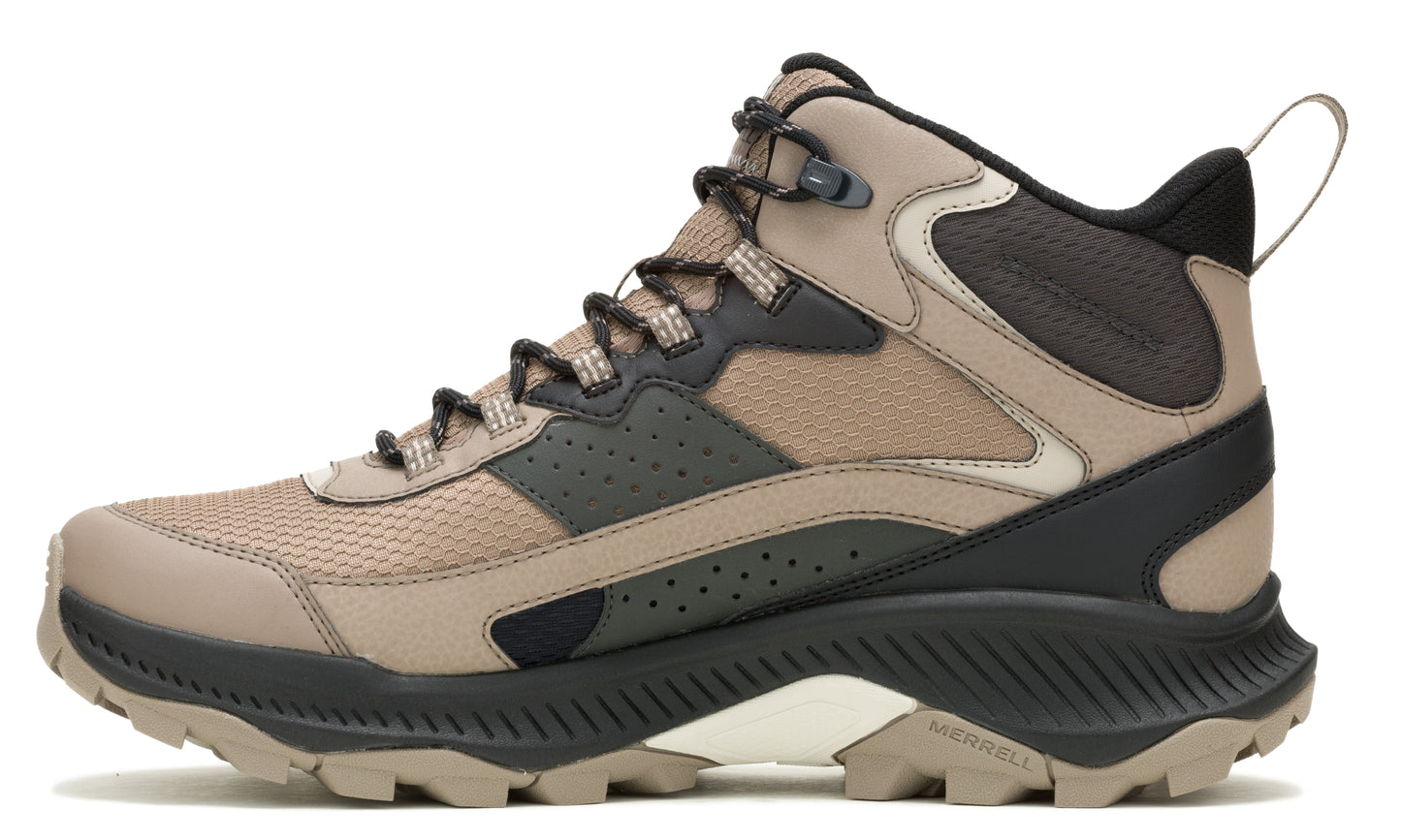 Hiking boot with a beige upper, black trim, and a thick, heavily lugged sole.