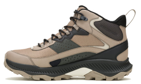 Hiking boot with a beige upper, black trim, and a thick, heavily lugged sole.