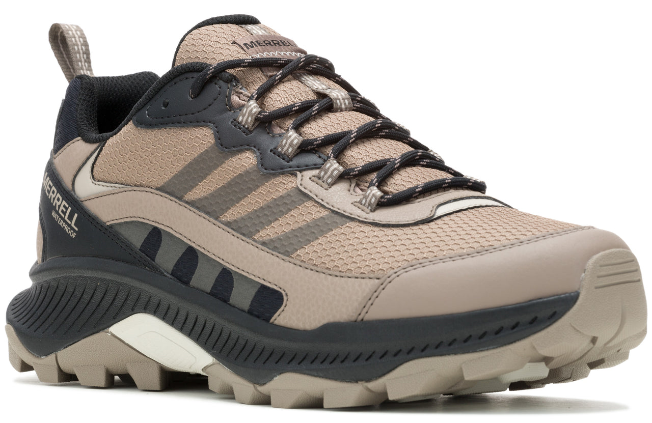 Low-top hiking shoe with brown and black accents, lace-up closure, and a rugged sole.