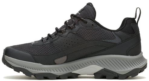 A low-top black athletic shoe with gray sole and black shoelaces.