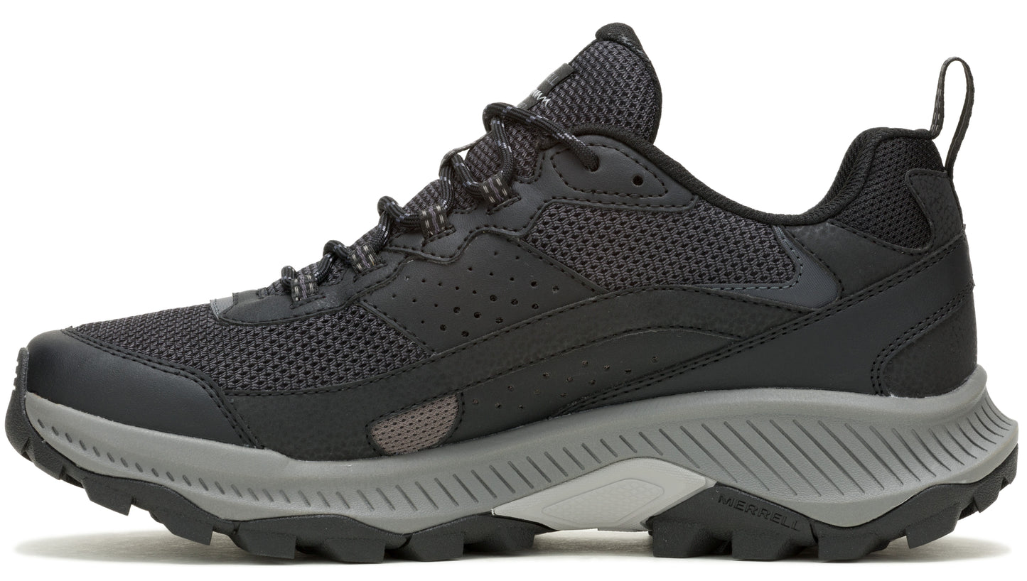 A low-cut black hiking shoe with mesh and synthetic upper, gray midsole, and lugged outsole.