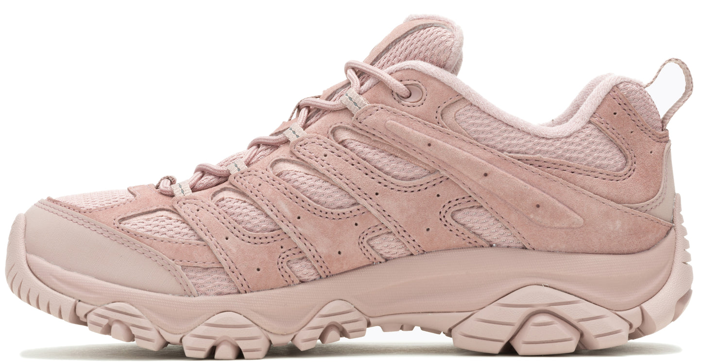 A pink hiking shoe with a low profile and lugged sole.