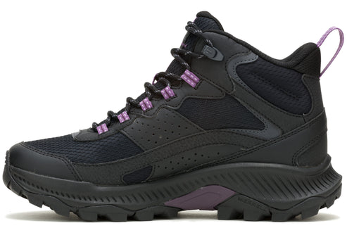 A black mid-rise hiking boot with purple accent laces.