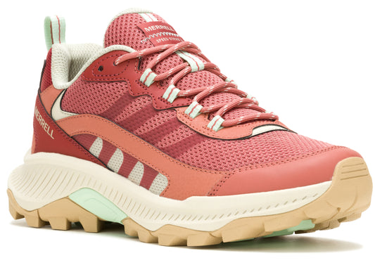 A pink and coral athletic shoe with off-white and mint green accents, laces, and soles.