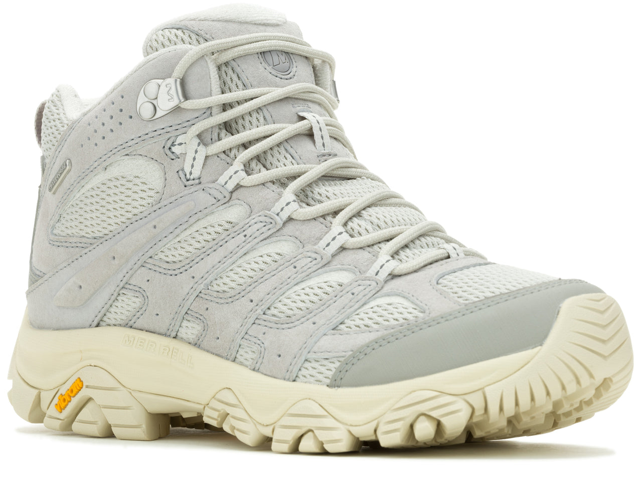 High-top hiking boot, light gray with white laces, and off-white Vibram sole.