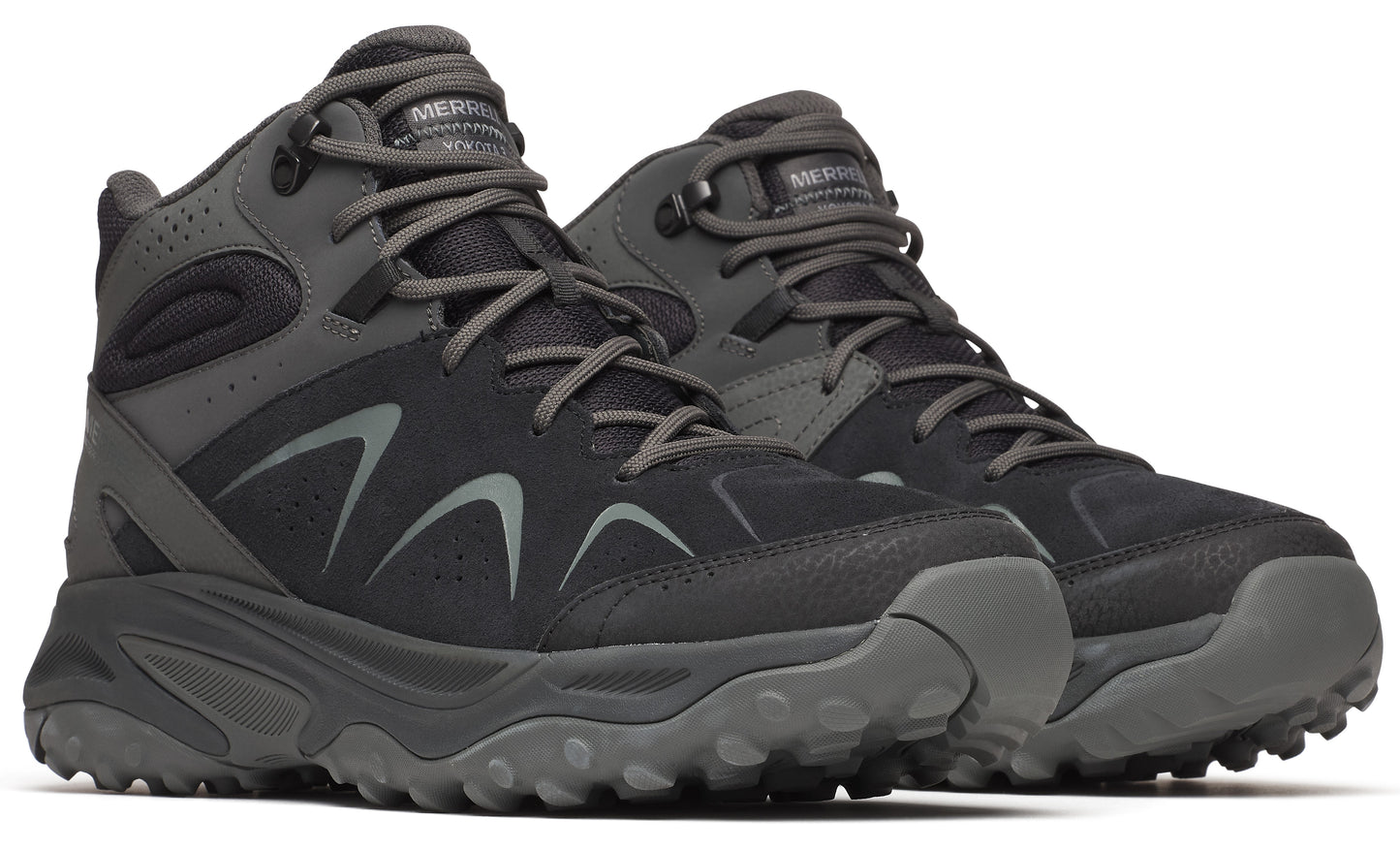 Pair of mid-height hiking boots in dark gray with textured soles and lace-up closure.