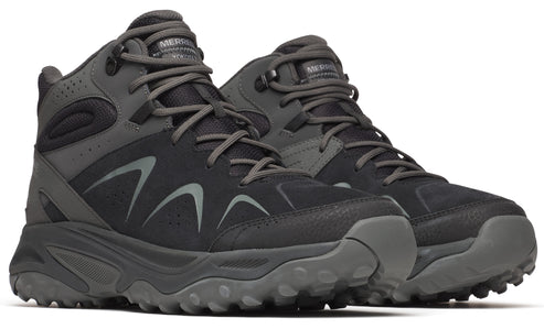Pair of mid-height hiking boots in dark gray with textured soles and lace-up closure.