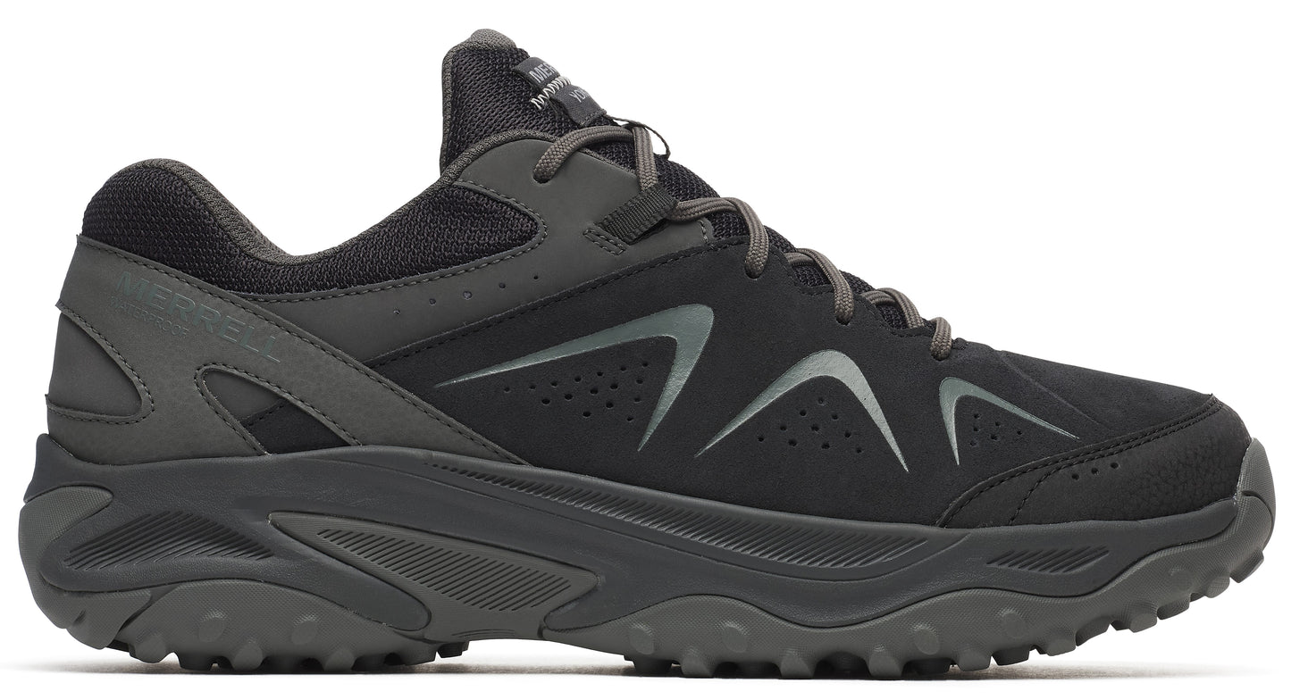 A dark gray running shoe with a thick treaded sole and a silver design on the side.