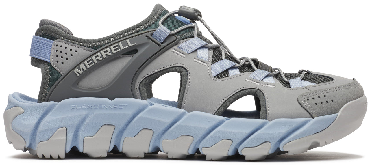 A gray and blue sandal with a thick, zigzag sole and the word "MERRELL" on the side.