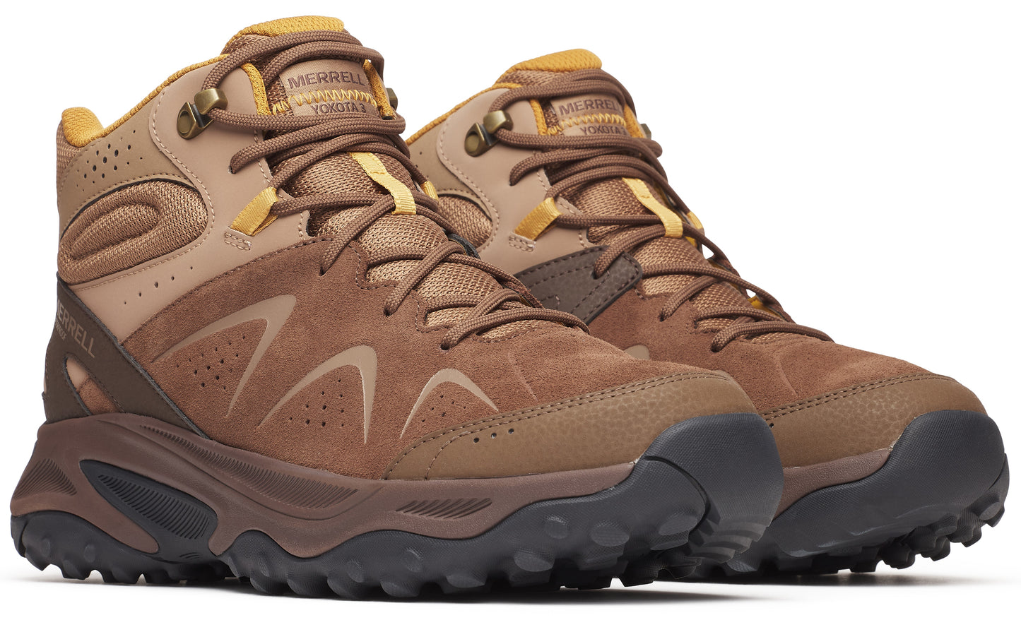 Hiking boots in brown and tan with visible laces and treaded soles.