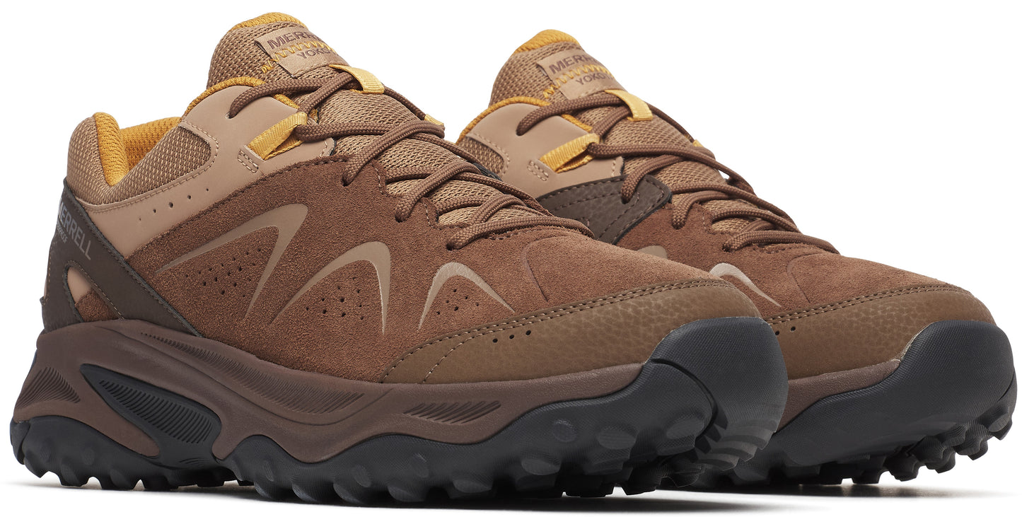 Two brown hiking shoes with a lace up design and a rubber sole.