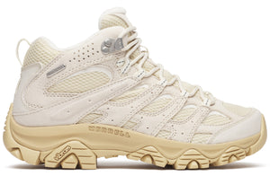 Beige hiking boot with vibram sole and 'Merrell' printed near the sole.