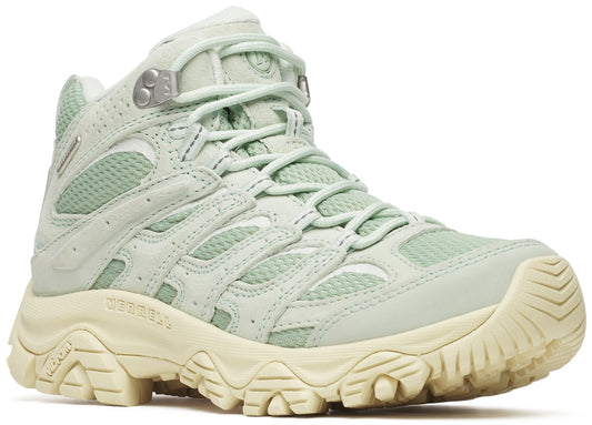 Light green hiking boot with textured rubber sole and silver metal eyelets.