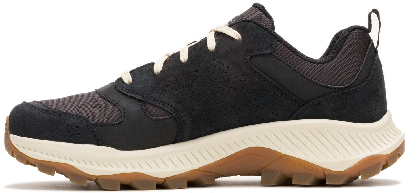 A low-cut sneaker in black with a tan rubber sole and white laces.