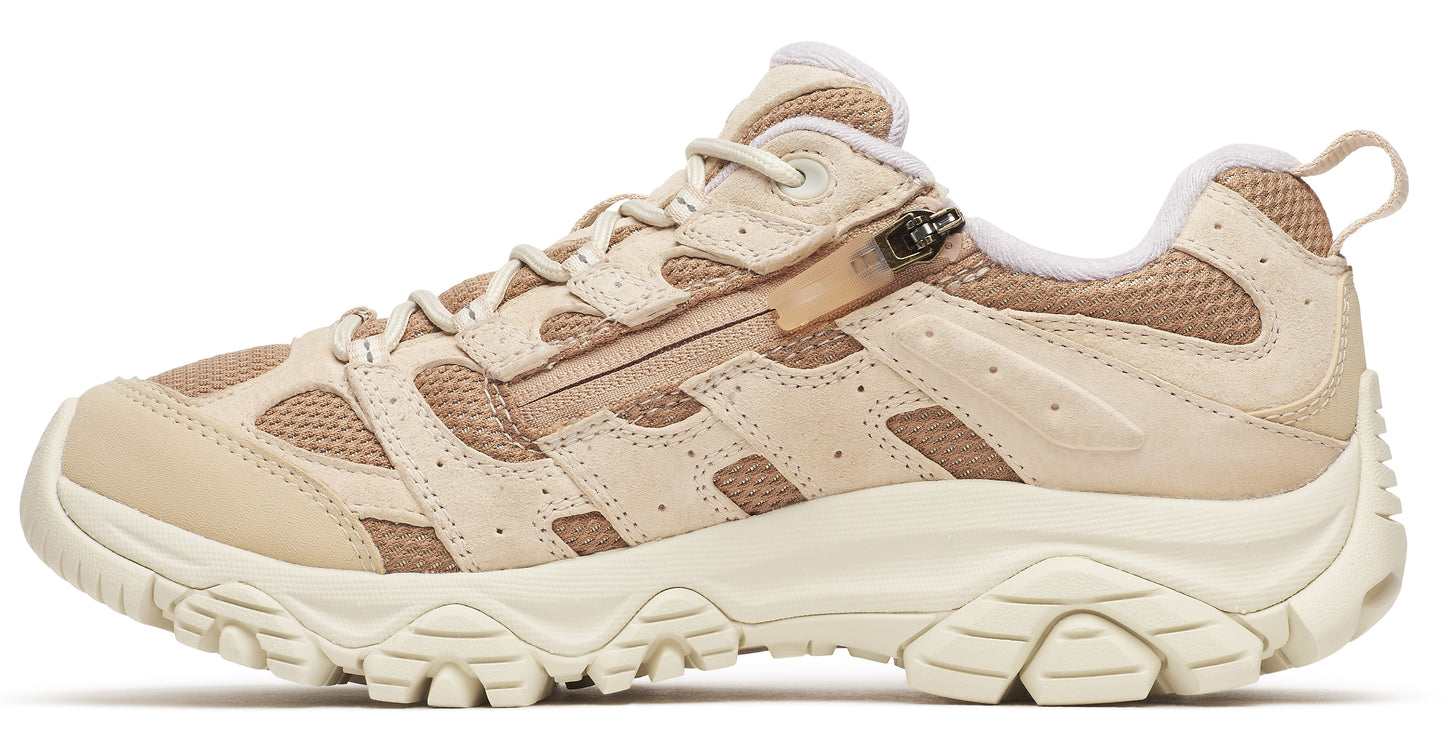 Beige hiking shoe with zippered lace cover and lug sole.