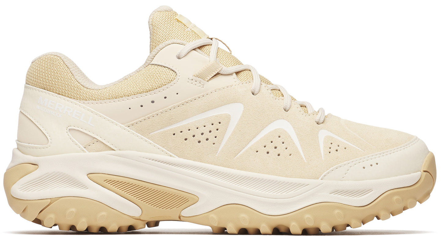Beige sneaker with a chunky sole, textile upper, and perforated accents.