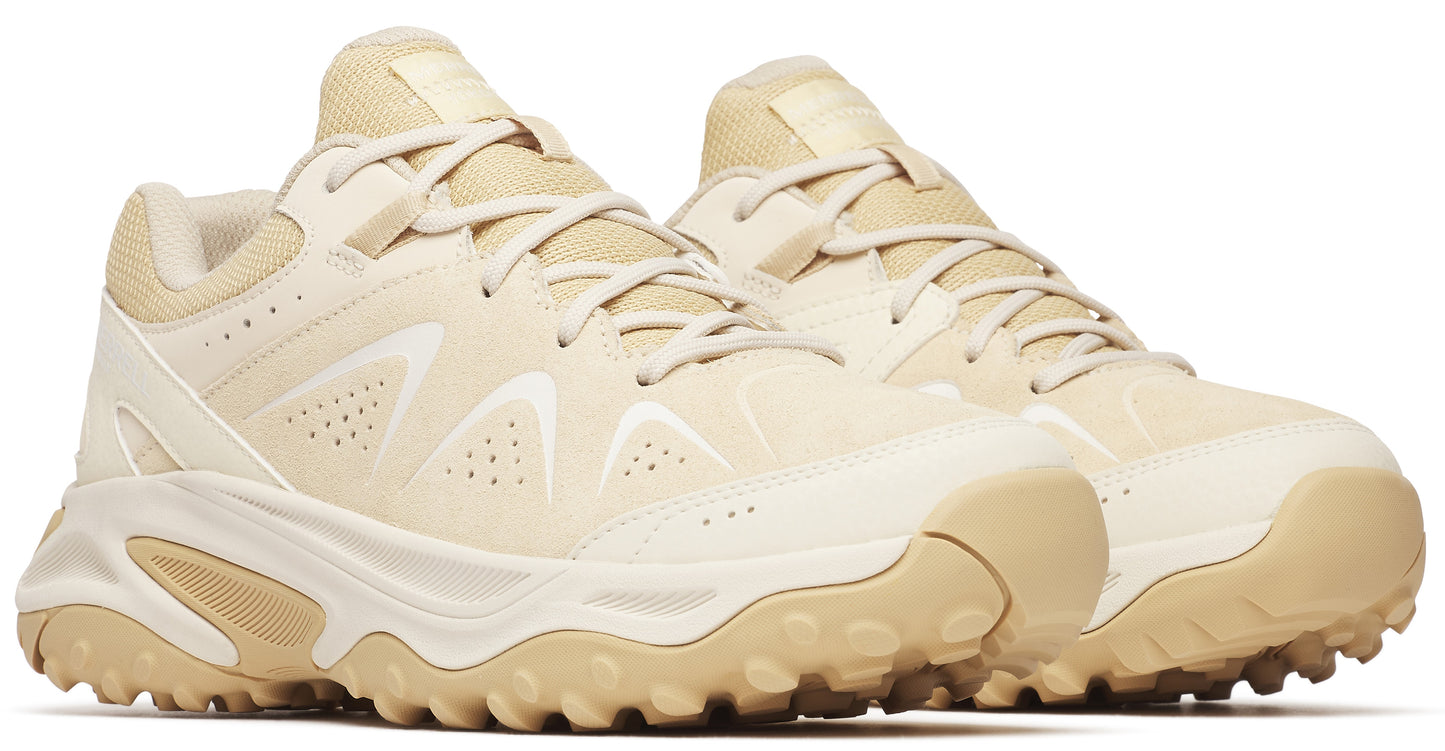 Beige athletic shoe with a rugged sole and lace-up closure.