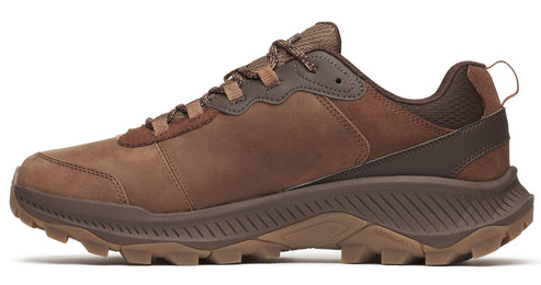 A brown leather trail running shoe with lug sole and a pull-tab at the heel.