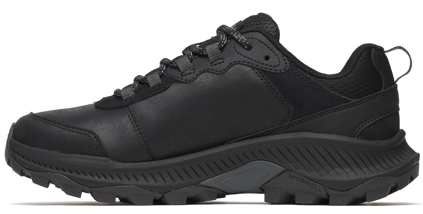 Black trail running shoe with lugged sole, lace-up closure, and pull tab.