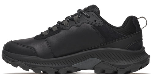 Black trail running shoe with lugged sole, lace-up closure, and pull tab.