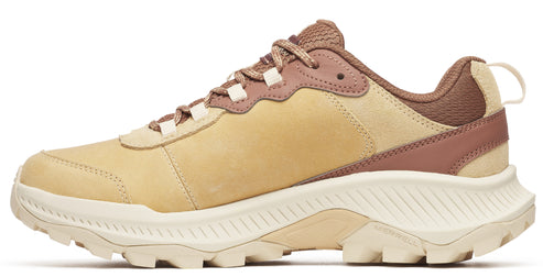 Tan sneaker with a thick white sole and brown accents.