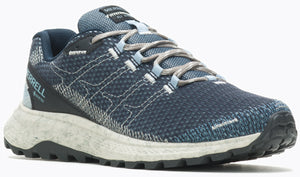 Low top athletic shoe with a blue upper, gray laces, speckled white midsole, and black lug outsole.