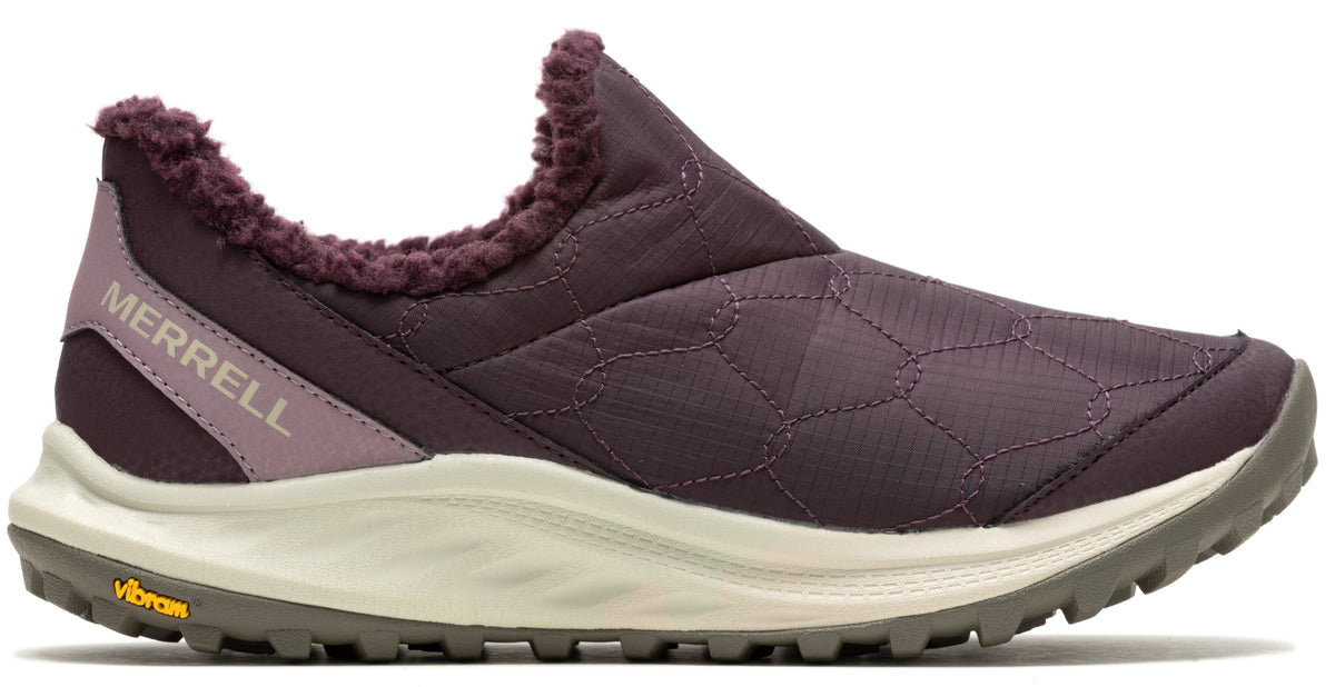 Slip-on Merrell shoe with purple patterned upper, light purple heel stripe reading "MERRELL", and faux fur trim.