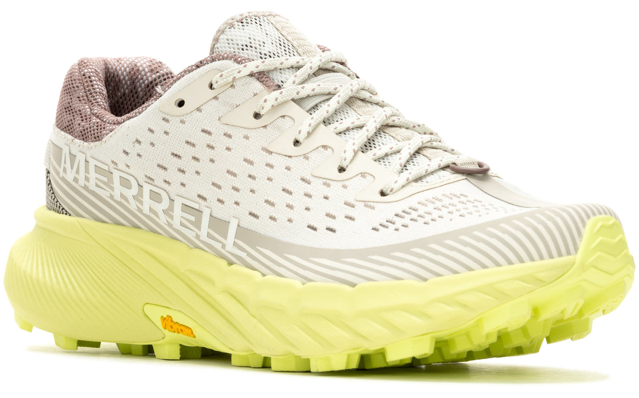 Off-white athletic shoe with a yellow sole and the word MERRELL printed on the side.