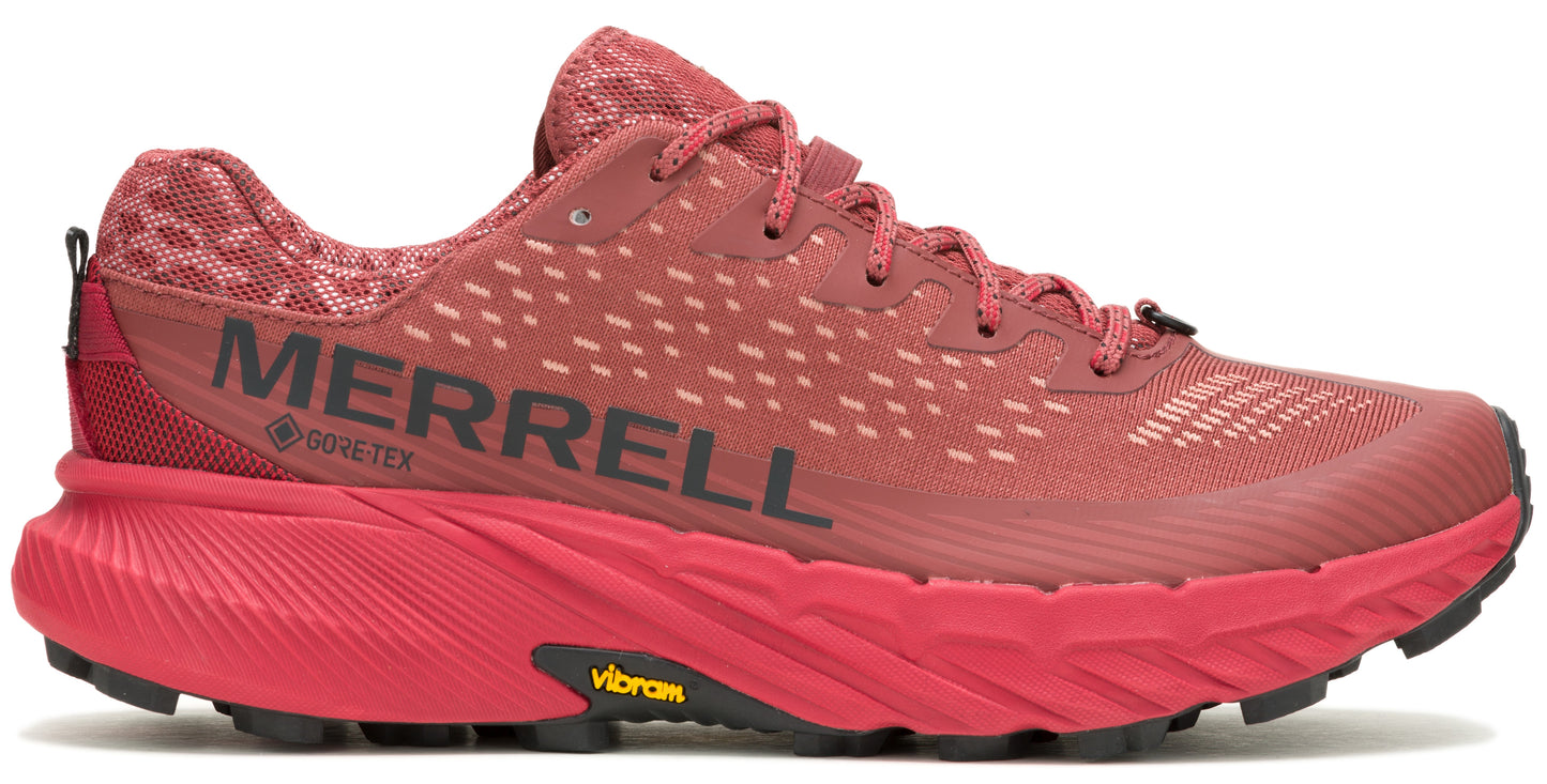 A red athletic shoe with black lettering and laces.