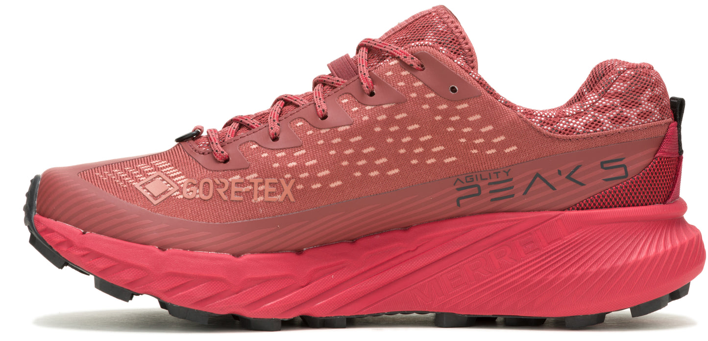 A red running shoe with GORE-TEX and ABILITY PEAK 5 printed on the side.