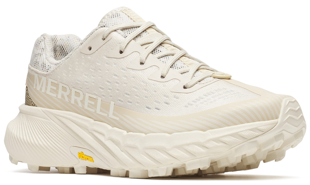Off-white running shoe with "MERRELL" printed on the side and a thick Vibram sole.